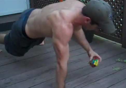 Ummmm… WOW! HOT Dude Does One-Handed Push-Ups While Solving A Rubik’s Cube In 25 Seconds!