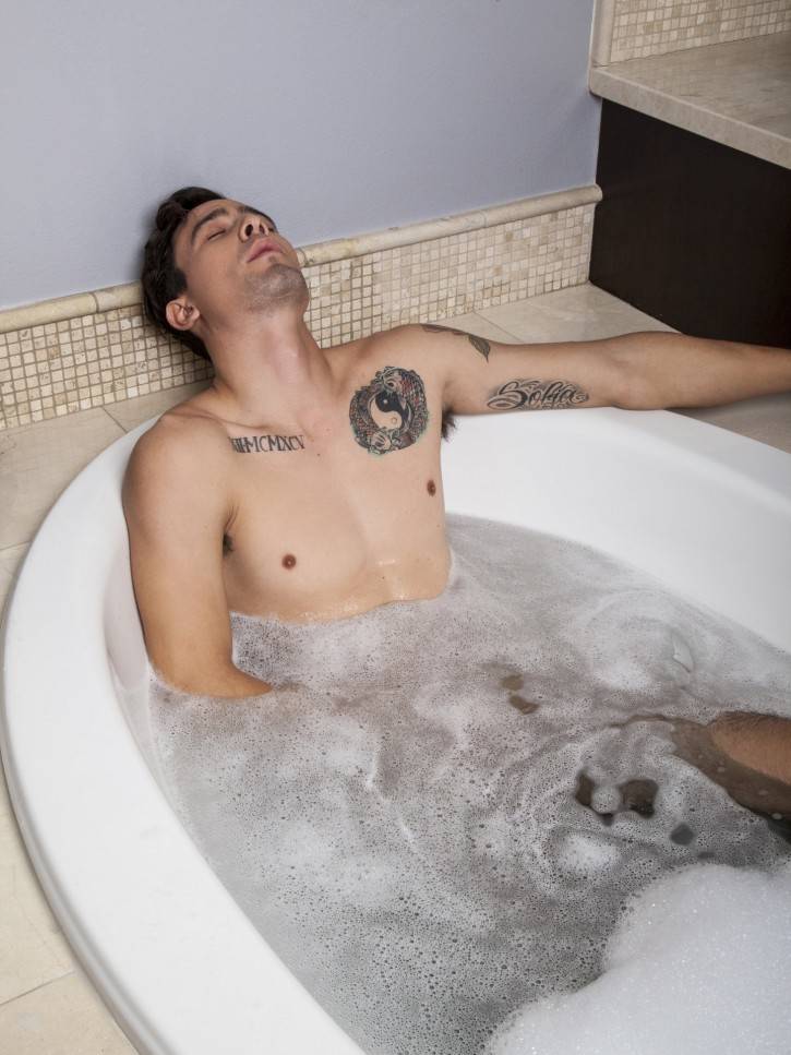 Franco Duran basks in the tub. He lets the suds cover his taut nipples and rippling pecs. He starts to clean his naked body, but a few strokes and his uncut cock gets hard as a rock. He beats off in the hot water and shows off his hot hairy hole. Then he gets up and dries off. Toweling the suds off his sexy muscled body. He is still hard and starts to jerk himself off even harder. He wants us to see him cum. He nuts right in the tub. Be sure to check out the free gay porn pics of the hot stud here at Randy Blue.