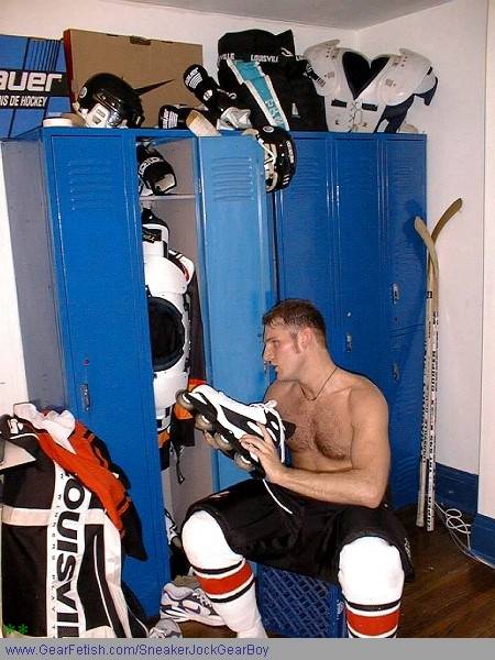 Hockey player changing into a jock