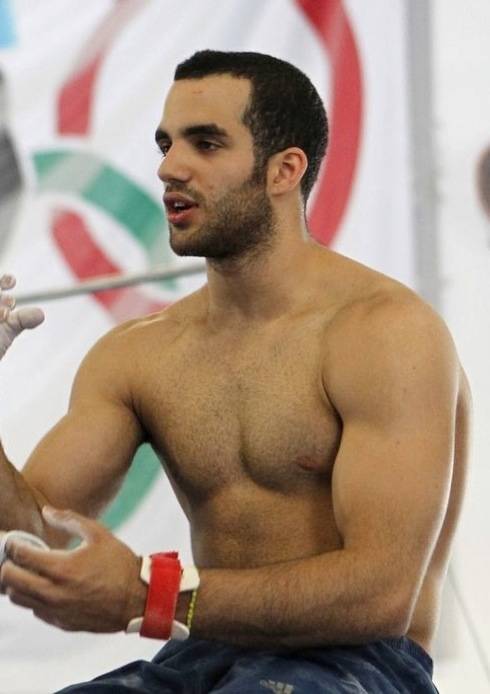 Danell Leyva showing his biceps