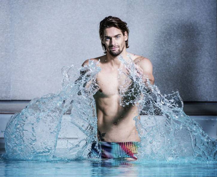 Camille Lacourt splashing water at the camera