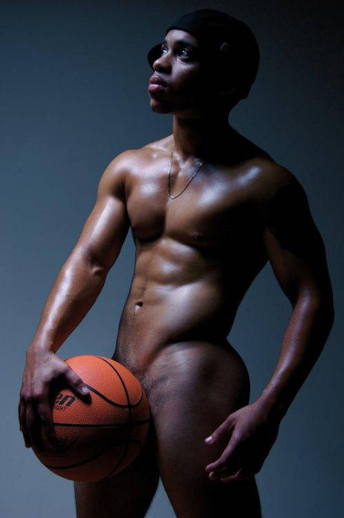 Hot basketball player covers his junk with a basketball