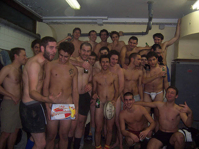 Teammates Share a Beer Naked