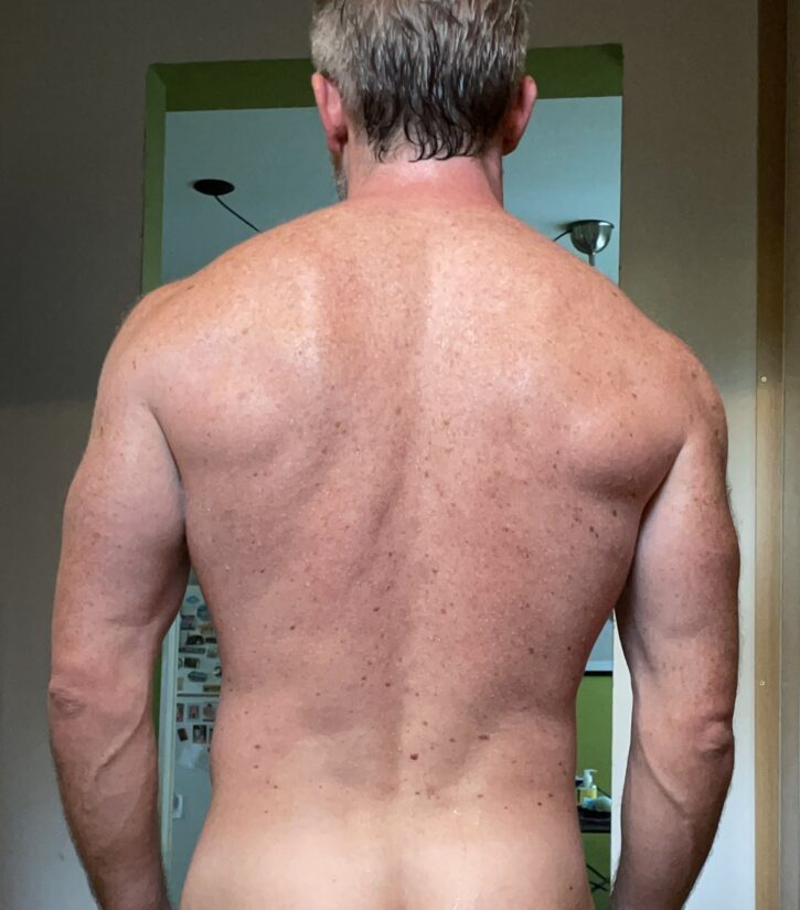 gay muscle daddy showing muscle back