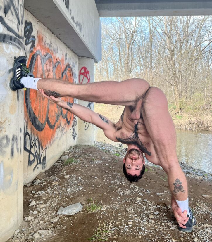 naked tattoo gay otter stretching under overpass