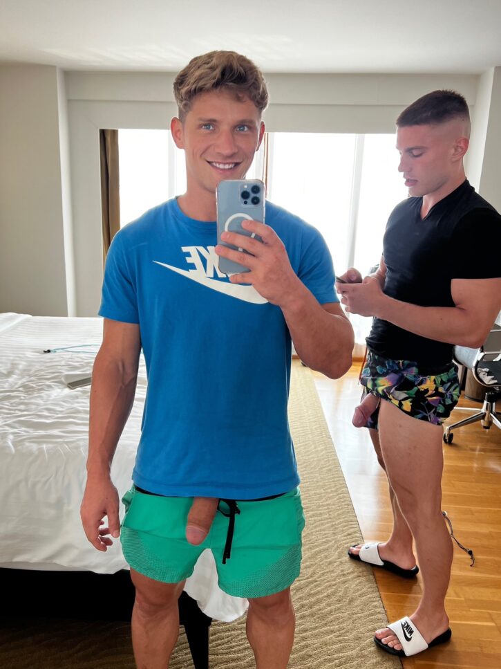 daniel knight taking gay mirror selfie with his cock hanging out of his green shorts