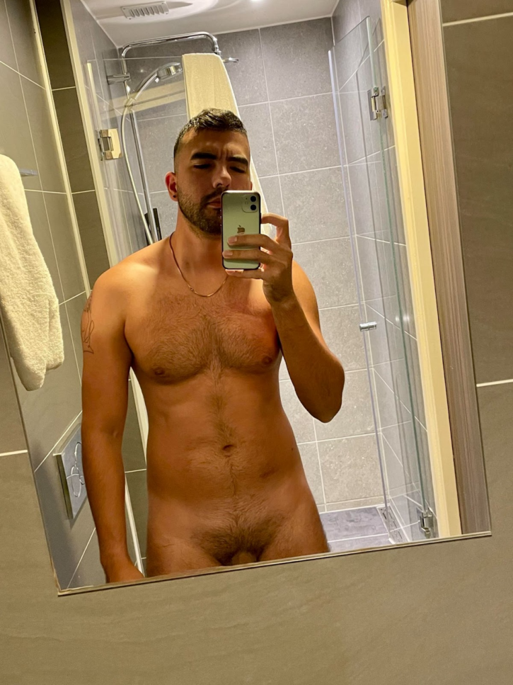 hot gay male in Amsterdam taking naked mirror selfies with pubes and cock in view