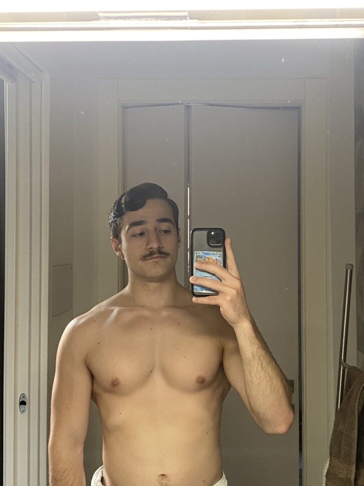 gay muscle twink posing with towel in mirror