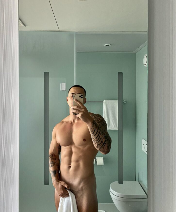 hot muscle stud posing in mirror selfie with towel over his dick