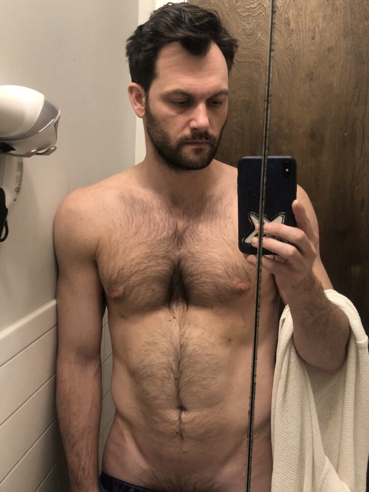 gay hairy otter taking half naked selfie in bathroom