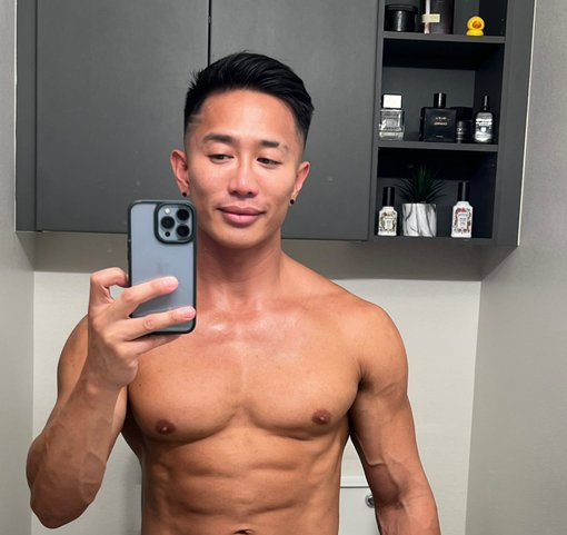 Jkab Ethan Dale posing in an iPhone mirror selfie naked and showing off his trimmed bush around his flaccid penis
