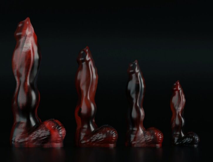 large silicone dildos from twisted beast arranged in a row by sizing and girth palced against a black backdrop