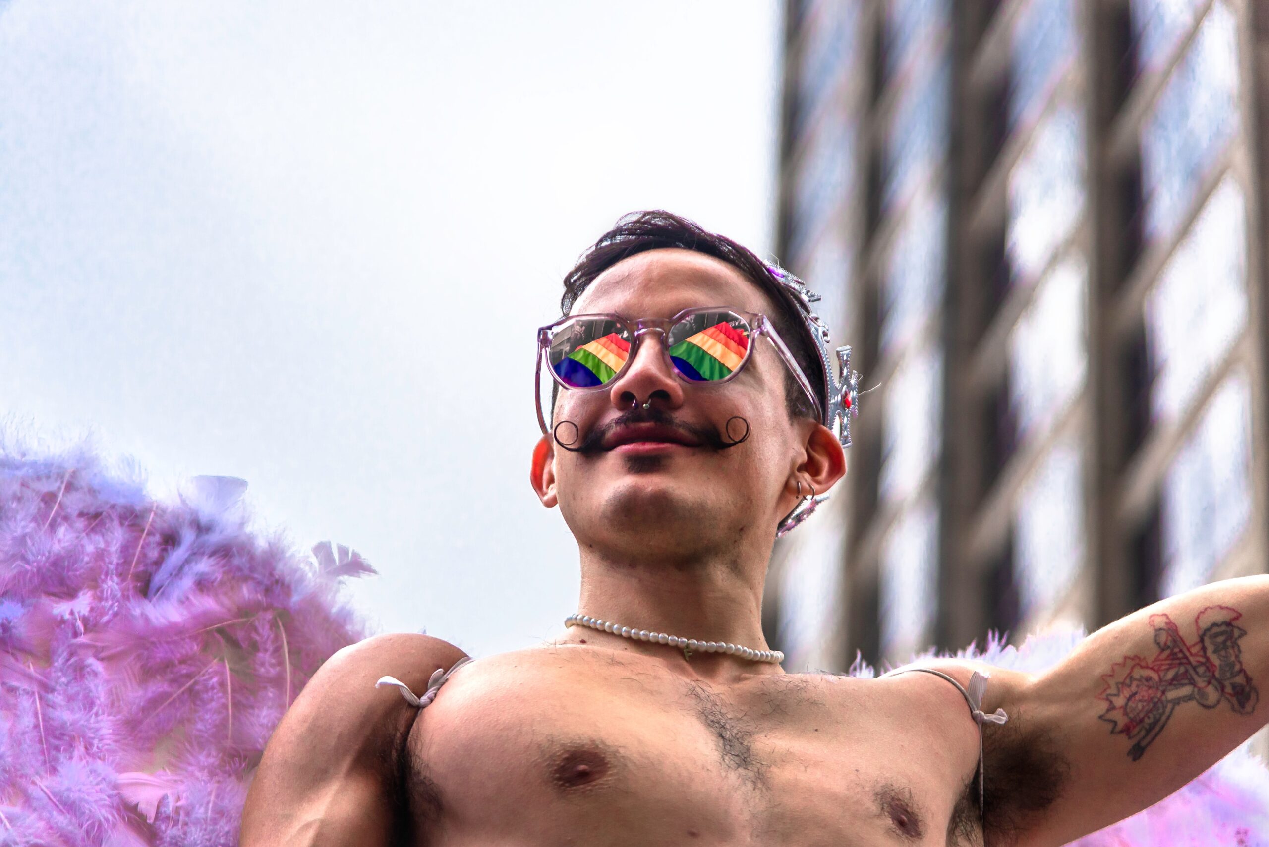 gay cruising hookup sexy male on a gay pride float in chicago illinois pride parade photo by Camila Mateus Sanchez via Pexels