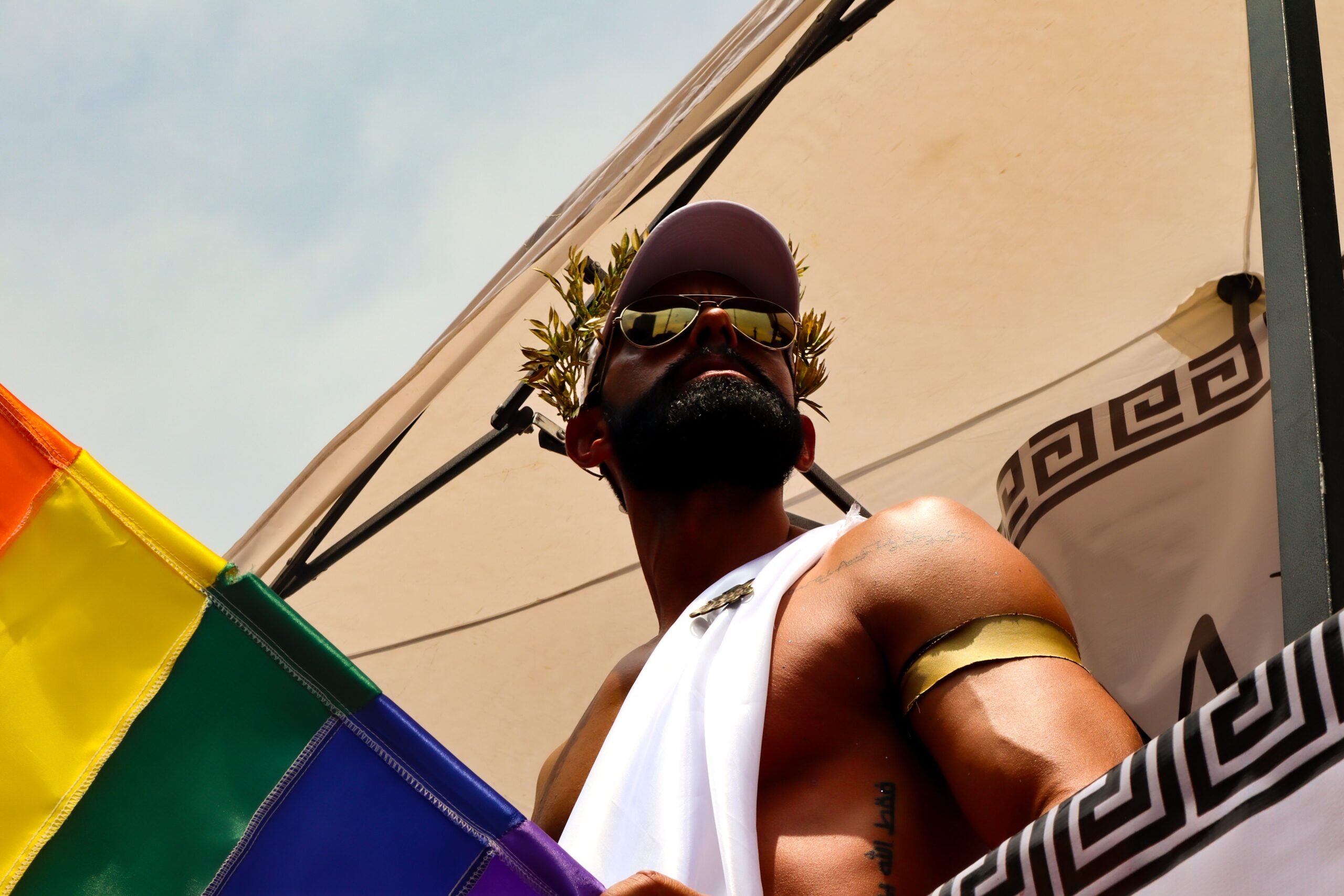 gay male standing outside in gay USA town looking for hot gay summer hookups during 4th of july weekend gay parties